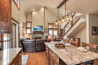 Vaulted ceilings and big windows bring the mountains right into the living room.