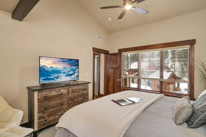 Wake up to soft light and mountain air in the primary king suite.