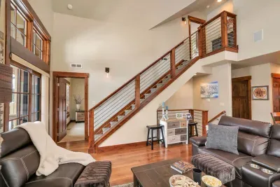 Designed for Connection and Relaxation: The open-concept main level invites laughter and warmth, while private ensuite bedrooms on separate floors ensure peaceful retreats after a day of adventure.