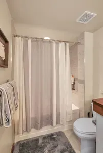 Convenience at Your Fingertips: The ensuite bathroom makes morning routines a breeze—no waiting in line, just quick access to freshen up and get back to the fun