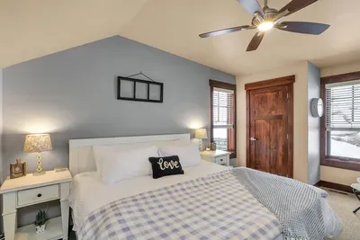 Top‑floor king suite feels like your own tucked‑away lodge.