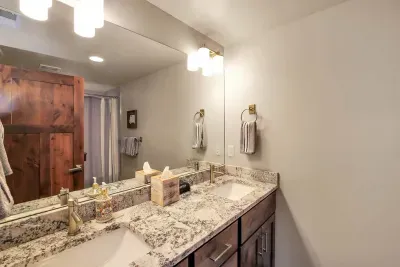Convenient and Cozy: With its own ensuite bath, this bunk room offers parents peace of mind while kids enjoy their own space—everyone's happy at Gold Crest!