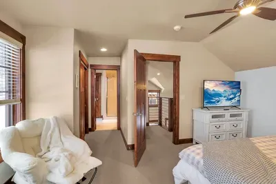 Third‑floor king suite: bright, private, and perfectly quiet. Ample storage with dual closets