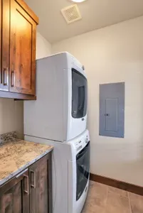 Laundry Made Easy: The spacious laundry room features full-sized front load washer/dryer and plenty of storage—perfect for keeping your gear clean and organized after a day of adventure