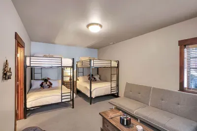 Kiddo's Dream Den On the first floor, this ensuite features two full/full bunk beds where your little adventurers can sleep tight after a day of fun—perfect for sleepovers and giggles