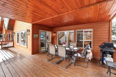 Covered back deck functions like a second living room during McCall’s long summer evenings.