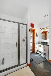 Wash off the day in the daylight basement bath, then head back out for the night. Offering easy access to the hot tub and groomed trail