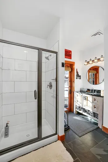 Wash off the day in the daylight basement bath, then head back out for the night. Offering easy access to the hot tub and groomed trail