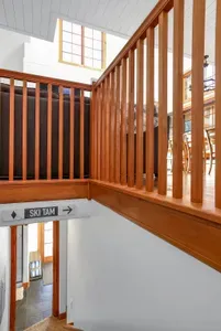 The Lair keeps the base simple: sleep well, soak hot, ski more. Head to the daylight basement for two guest bedrooms, a full bath, the hot tub, and access to everything the mountain has to offer