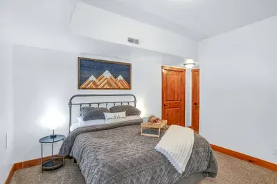 Not the “spare” room—this guest bedroom brings hotel-level comfort with a walk-in closet and streaming-ready TV.