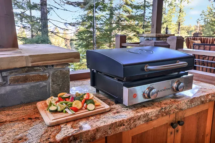 The Blackstone griddle turns breakfast into an event—bacon, eggs, and pancakes for ten, all at once, with lake views and morning light