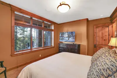 Privacy, comfort, and a touch of spa—king bed, soaking tub with a view, and a walk‑in shower that resets you