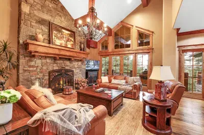 Timber and stone, floor-to-ceiling views, and a wood‑burning hearth. The Great Room is the heart of the lodge and the start of every great day