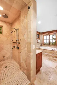 After the slopes, the steam shower resets you—warmth lingering as you wrap in plush towels and watch the pines outside
