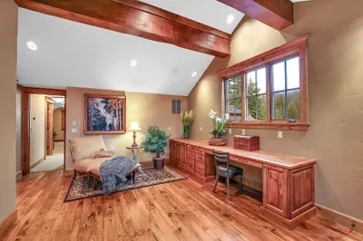 Connected yet tucked away, the loft balances work and rest—solid surface for laptops, soft landing for afternoon reads
