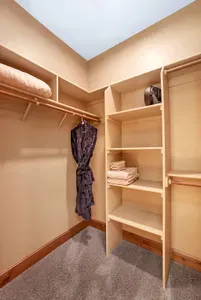 The walk‑in closet lets you unpack and exhale—luggage disappears, shelves and hanging space for days, and a week here feels like home