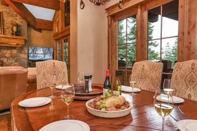 Set the table, open a bottle from the cellar, and let the wraparound deck and lake vista be the centerpiece