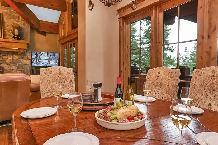 Set the table, open a bottle from the cellar, and let the wraparound deck and lake vista be the centerpiece