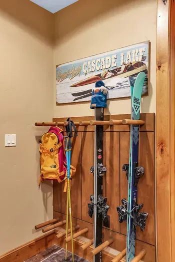 Racked skis, organized lockers, and a fitness room for warmups and cooldowns keep the whole crew in rhythm and powder ready