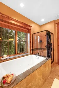 A spacious walk‑in shower and clean stone finishes keep the morning effortless and unhurried