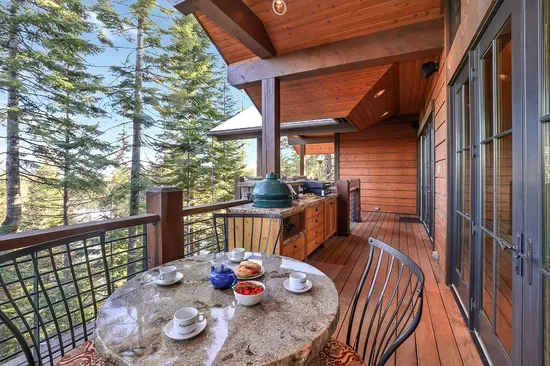 From sunrise to starlight, the wraparound balcony keeps you outside longer—gas fire pit, plenty of seating, and panoramas in every direction