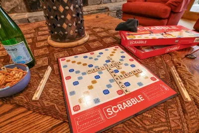 Cards on the table, fire crackling, glasses within reach—game night stretches under timber beams and turns into stories you’ll retell
