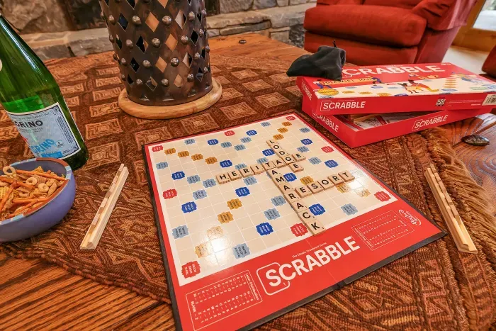 Cards on the table, fire crackling, glasses within reach—game night stretches under timber beams and turns into stories you’ll retell