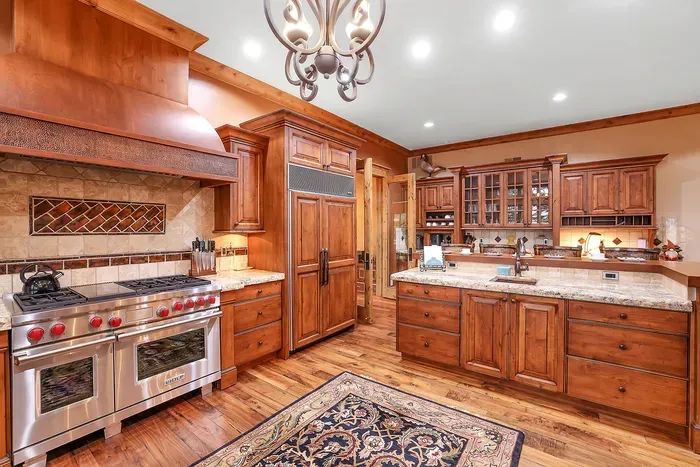 Wolf and Subzero anchor a chef’s kitchen built for gathering. Prep on butcher block, cook together, and let the island become the evening’s starting line