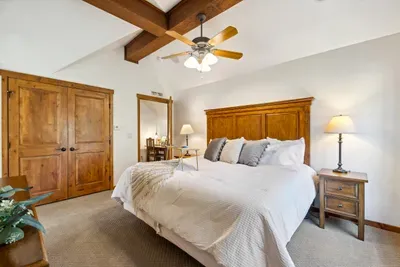 The relaxing primary suite has a king-sized bed; as the only room upstairs, it offers great privacy