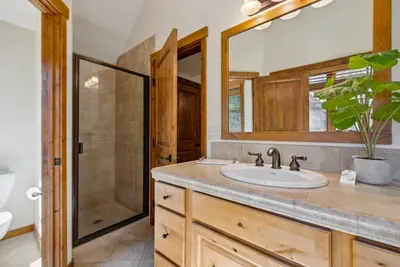 The primary ensuite has a large soaker tub as well as a stand-up shower