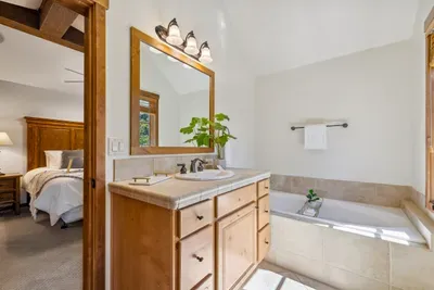 The primary ensuite has a large soaker tub as well as a stand-up shower