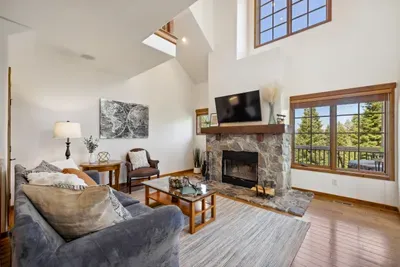 Enjoy alpine views and watching the falling snow in front of the wood-burning fireplace