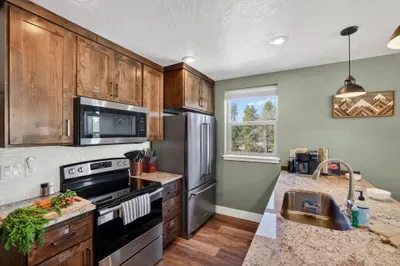 Full-sized stainless steel appliances and a well-stocked kitchen make cooking real meals, real simple