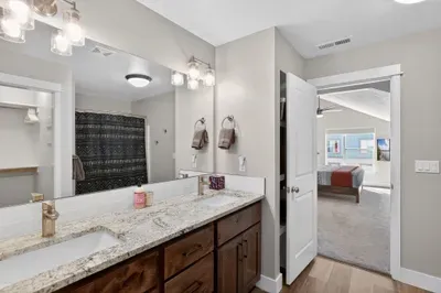 The spacious primary bathroom with dual sinks makes getting ready for dinner in downtown McCall easy.