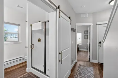The first‑floor bathroom/laundry room sits right off the entry, perfect for quick showers after Brundage laps, muddy hikes, or lake swims