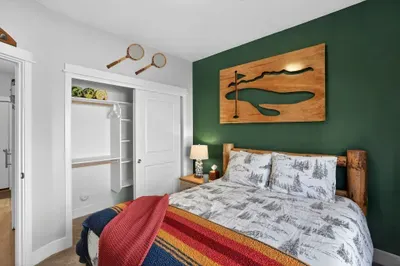 The first‑floor queen bedroom offers privacy and fewer stairs for early‑riser adventurers.