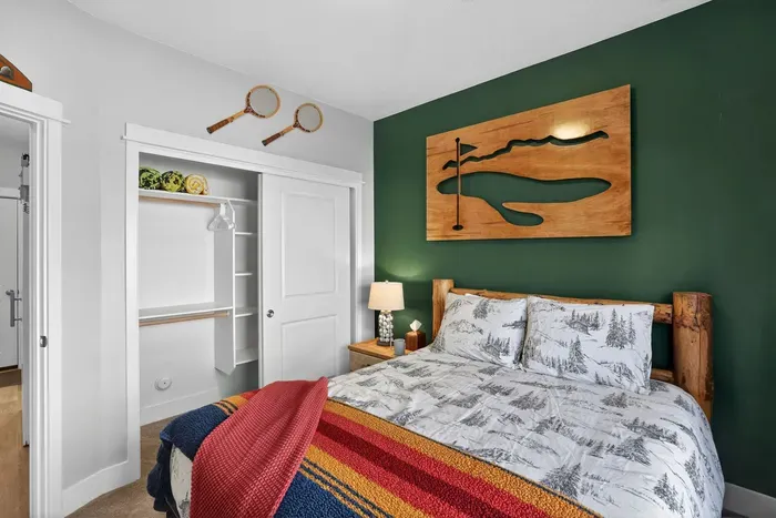 The first‑floor queen bedroom offers privacy and fewer stairs for early‑riser adventurers.