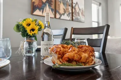 Sit down to family‑style meals at the dining table, then clear it for maps, laptops, and card games.