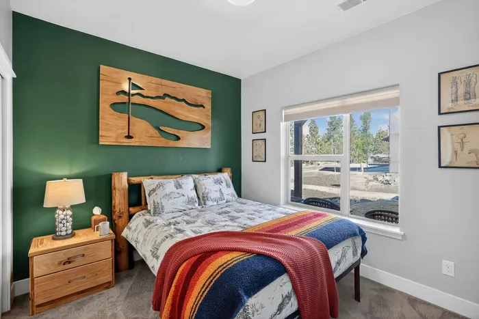 Golf‑themed decor in the 1st level queen room brings Jug Mountain and McCall Golf Club energy home.