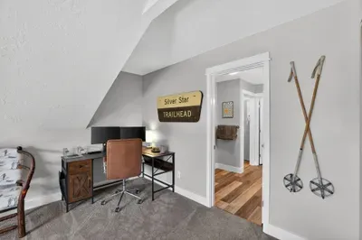 Trade the office for alpine views—set up at the primary bedroom workstation with two monitors, fast WiFi, and a quiet top‑floor setting.