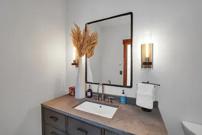 The main floor features a convenient half bath, perfect for guests and ensuring comfort and ease during your stay.