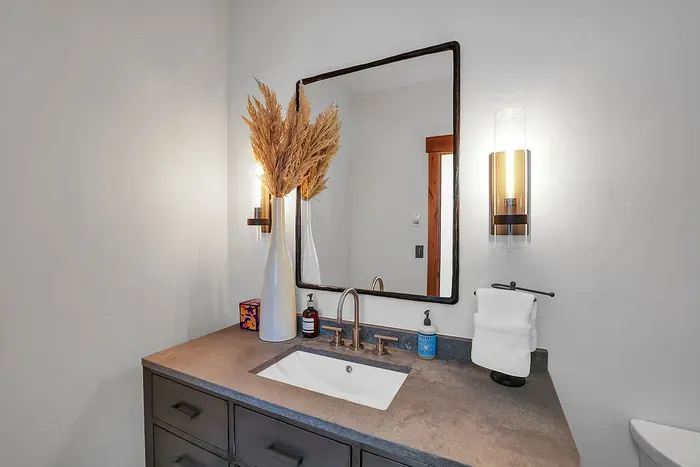 The main floor features a convenient half bath, perfect for guests and ensuring comfort and ease during your stay.
