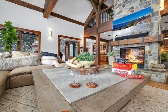 Morning coffee spot or nightcap lounge—the living room shifts easily from bright and airy to firelit and cozy.