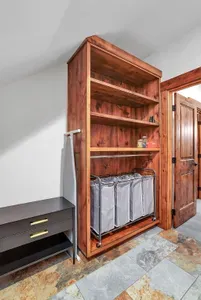 Enjoy the ease of a well-equipped laundry room, complete with ample storage, counter space, and essentials like Tide pods and dryer sheets, making laundry a breeze during your stay.