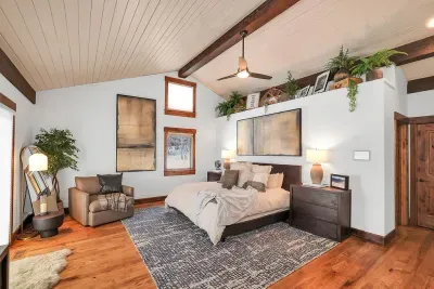 The primary suite is your private retreat after big mountain days—quiet, spacious, and tucked away on the main level. Features a king bed and massive walk-in closet