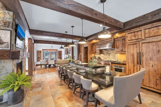 The kitchen boasts sushi bar-style seating for ten, making it a perfect place for family and friends to gather, dine, and share unforgettable meals.