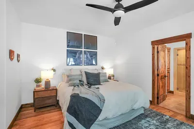 A California king, Pottery Barn linens, warm textures, and simple, modern mountain design make this room an easy place to land at the end of the day.