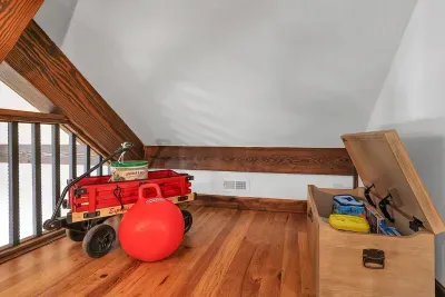 The loft's children's nook is a whimsical haven, complete with toys and games that spark creativity and fun for kids of all ages.