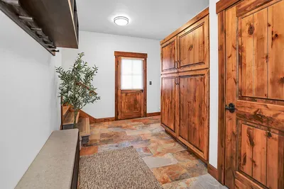 Enjoy the convenience of a two-car garage and this spacious mudroom with ample storage, perfect for organizing all your gear and equipment during your stay.