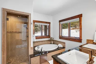 Trade lift lines for quiet time: draw a bath, shut the door, and let this suite be your personal après spot.